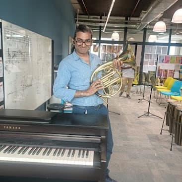 Mahesh at Music Studio — French Horn & Yamaha Grand Piano